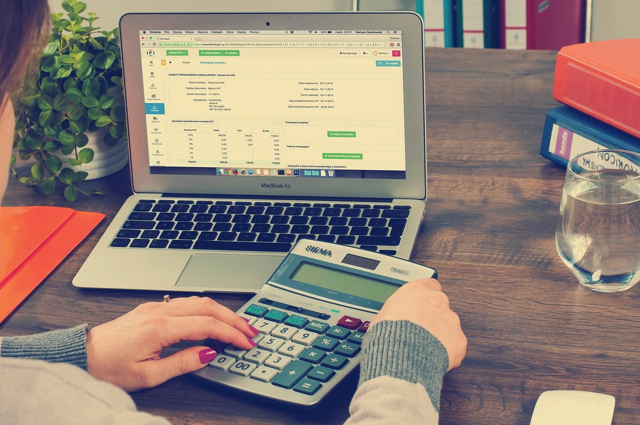 accountant with a laptop open and calculator