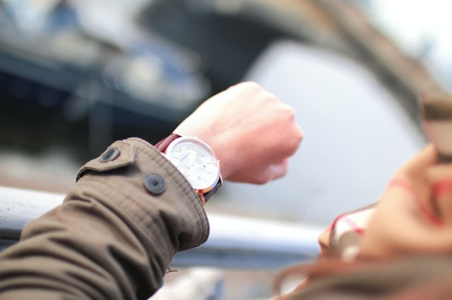 selective focus of someone looking at their watch